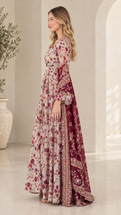 Side profile view of woman in flowing floral maxi gown with bell sleeves