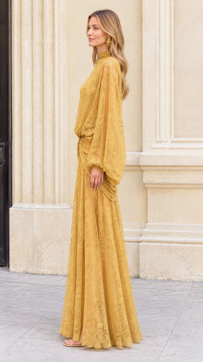 Side profile view of Mustard Yellow high neck lace maxi dress showing sleeve drape and skirt flow