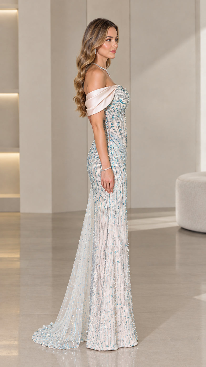 Side view of ice blue embellished formal gown showing silhouette and train