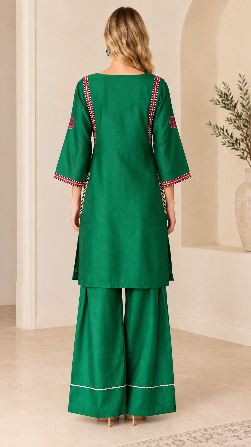 Back view of model wearing Emerald Green tunic top and matching palazzo pants