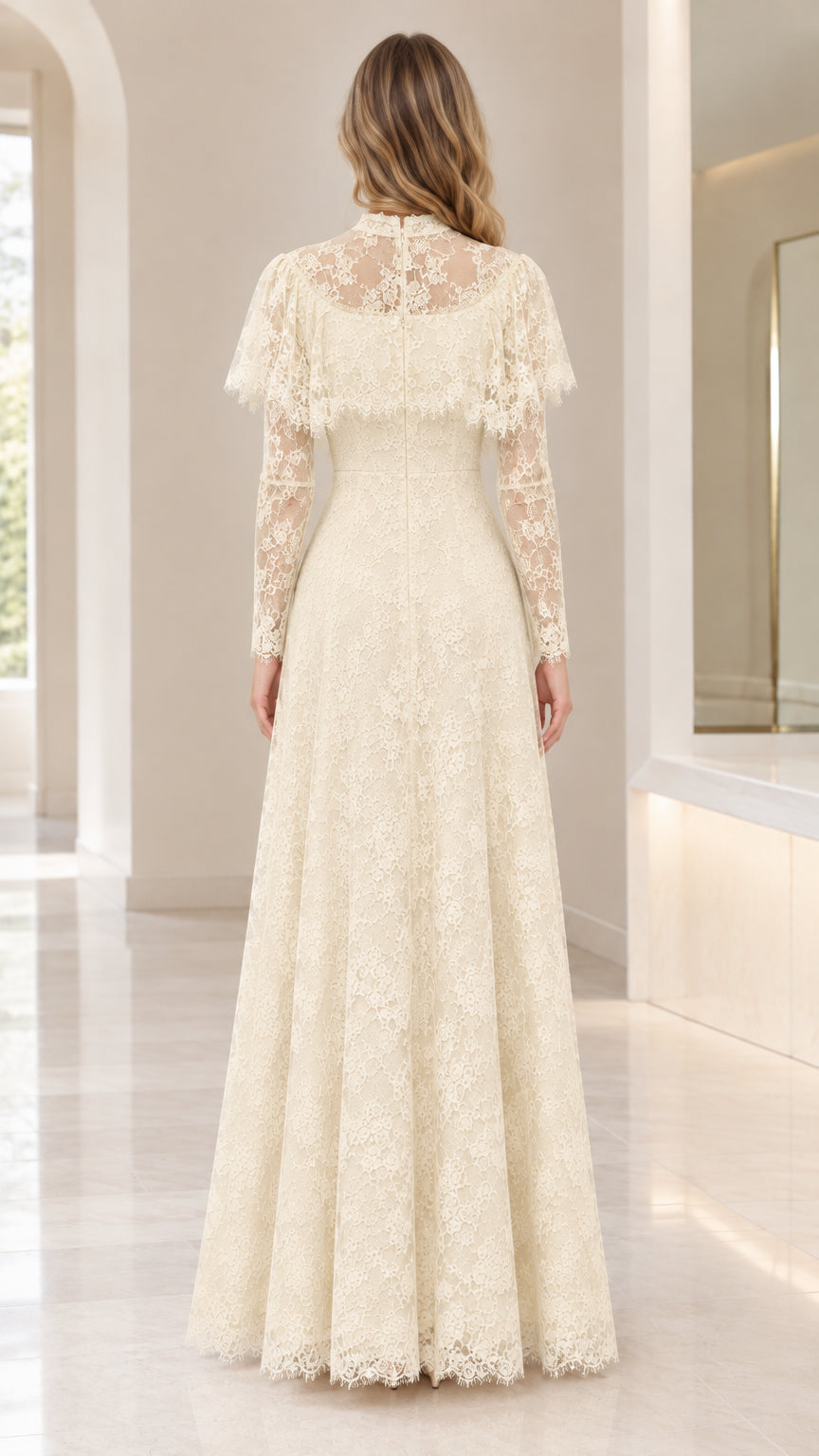 Back view of woman wearing ivory lace maxi dress with capelet