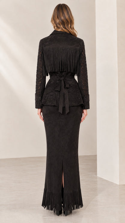 Back view of black fringe jacket showing tie waist and slit maxi skirt