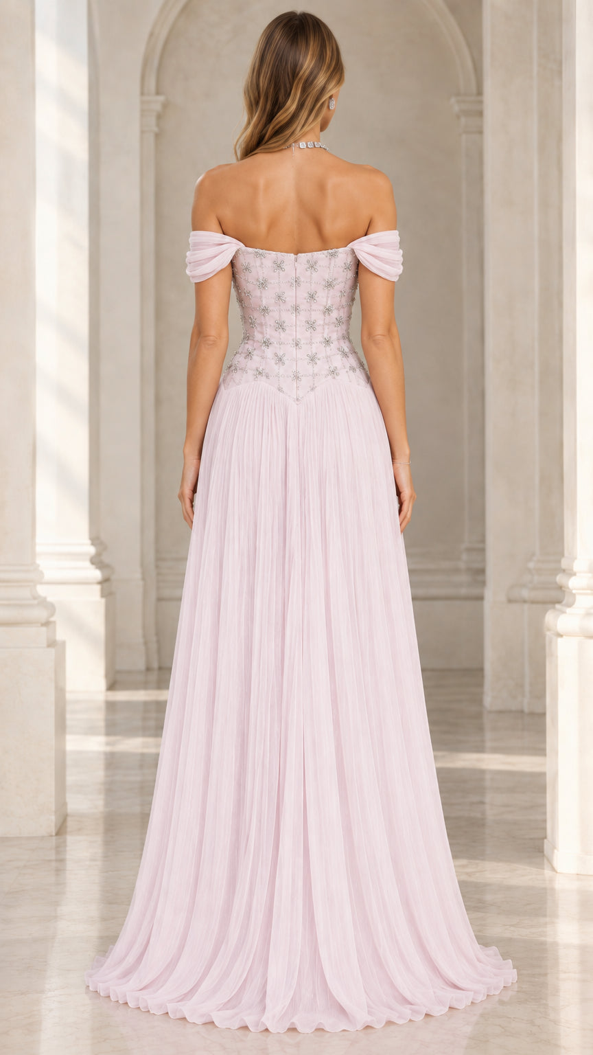 Back view of woman in blush pink off-the-shoulder beaded formal gown