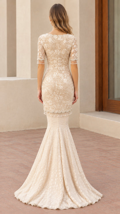 Back view of champagne lace mermaid evening dress showing tailored fit and flared hem