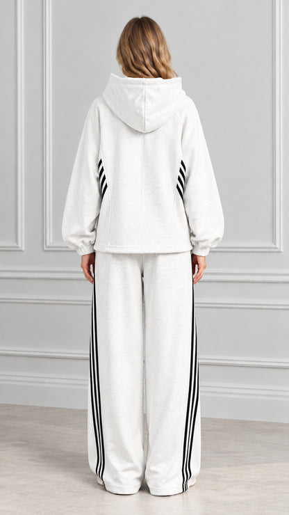 Back view of woman wearing Heather Gray hooded sweatshirt and wide-leg lounge pants