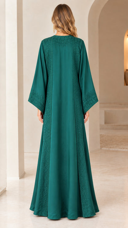 Back view of woman wearing emerald green floor-length caftan dress