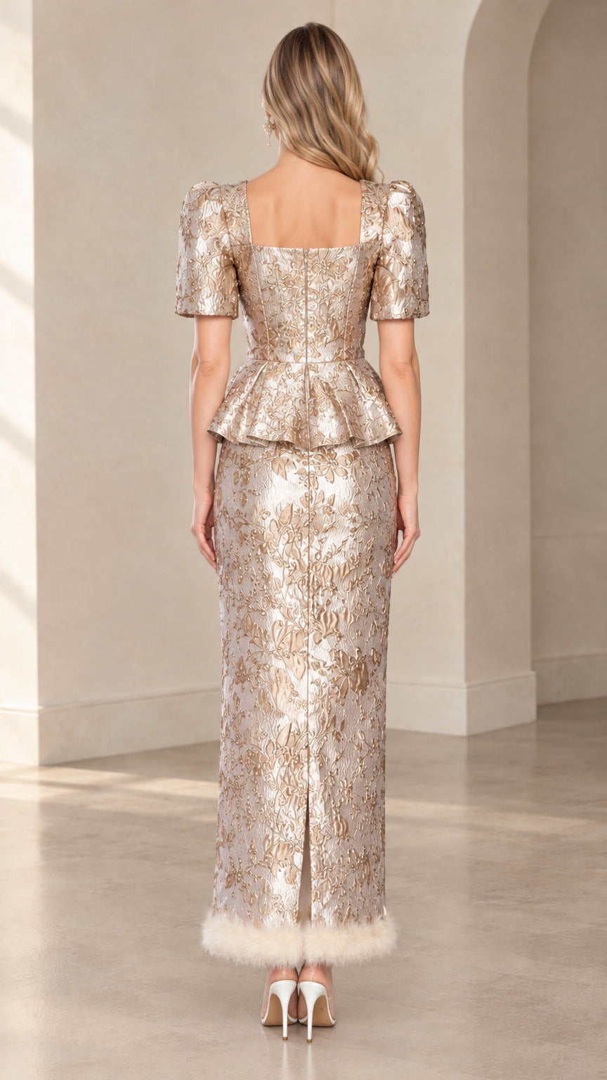 Back view of champagne jacquard peplum top and slit maxi skirt set