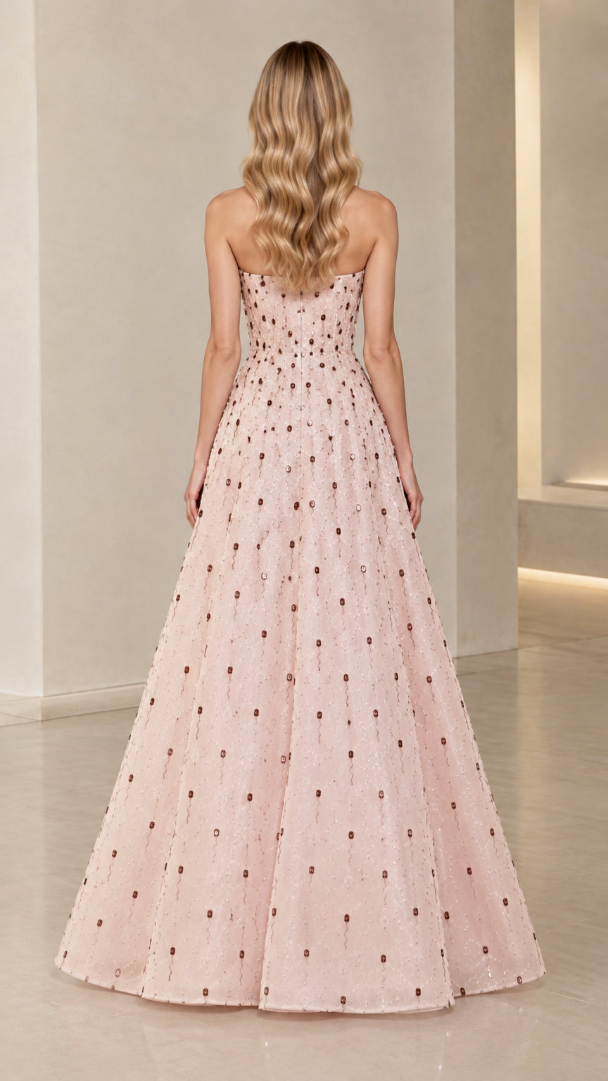Back view of Blush Pink strapless evening gown showing fitted back and full skirt