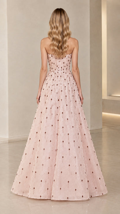 Back view of Blush Pink strapless evening gown showing fitted back and full skirt