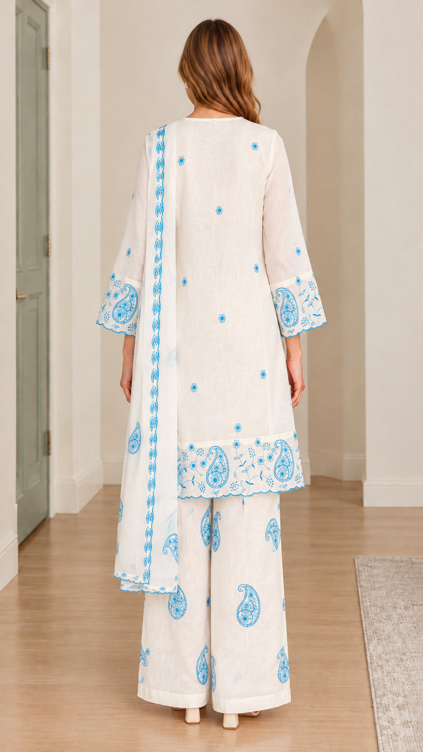 Back full-length view of white embroidered tunic set with wide-leg pants