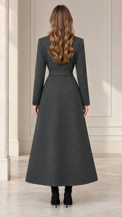 Back full-length view showing the structured drape of the charcoal grey maxi coat