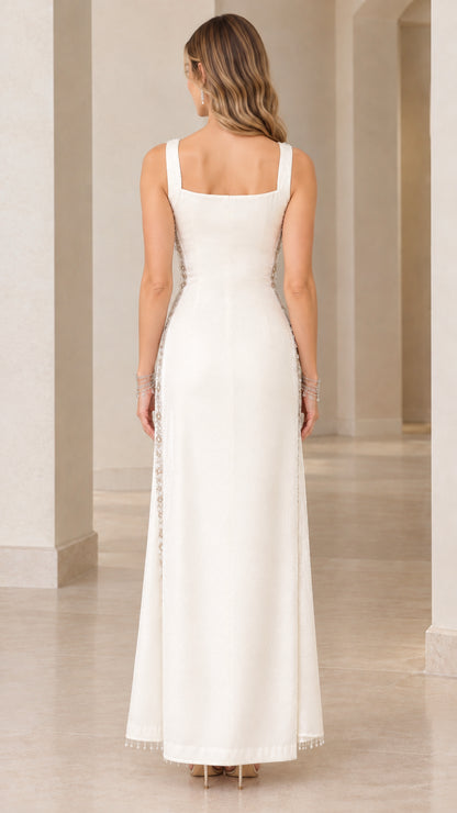 Back view of woman wearing ivory formal gown featuring square back neckline