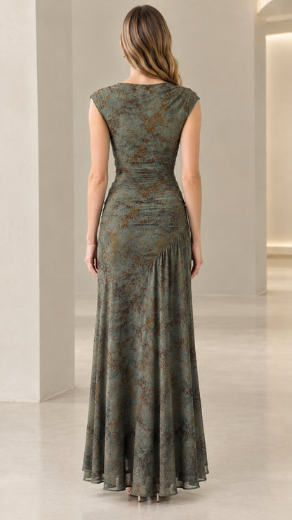 Back view of model wearing sleeveless olive green floral maxi dress