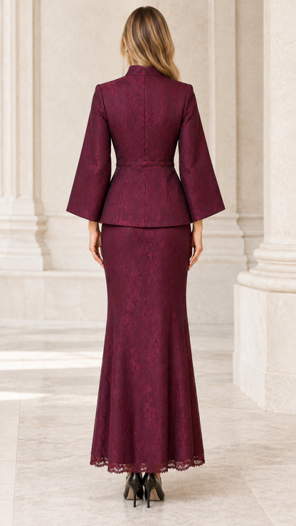 Back view of woman wearing burgundy lace two-piece peplum jacket and maxi skirt
