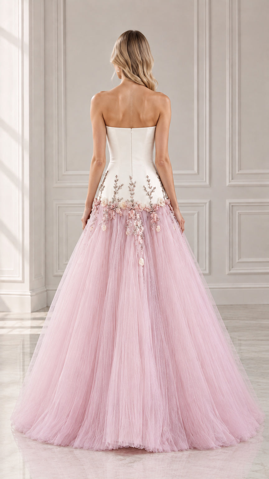 Back view of strapless white and pink evening gown showing fitted back and flared skirt
