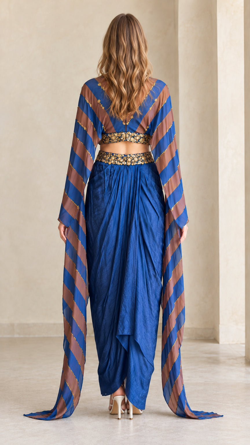 Back view of model wearing Royal Blue embellished cape top and dhoti trousers