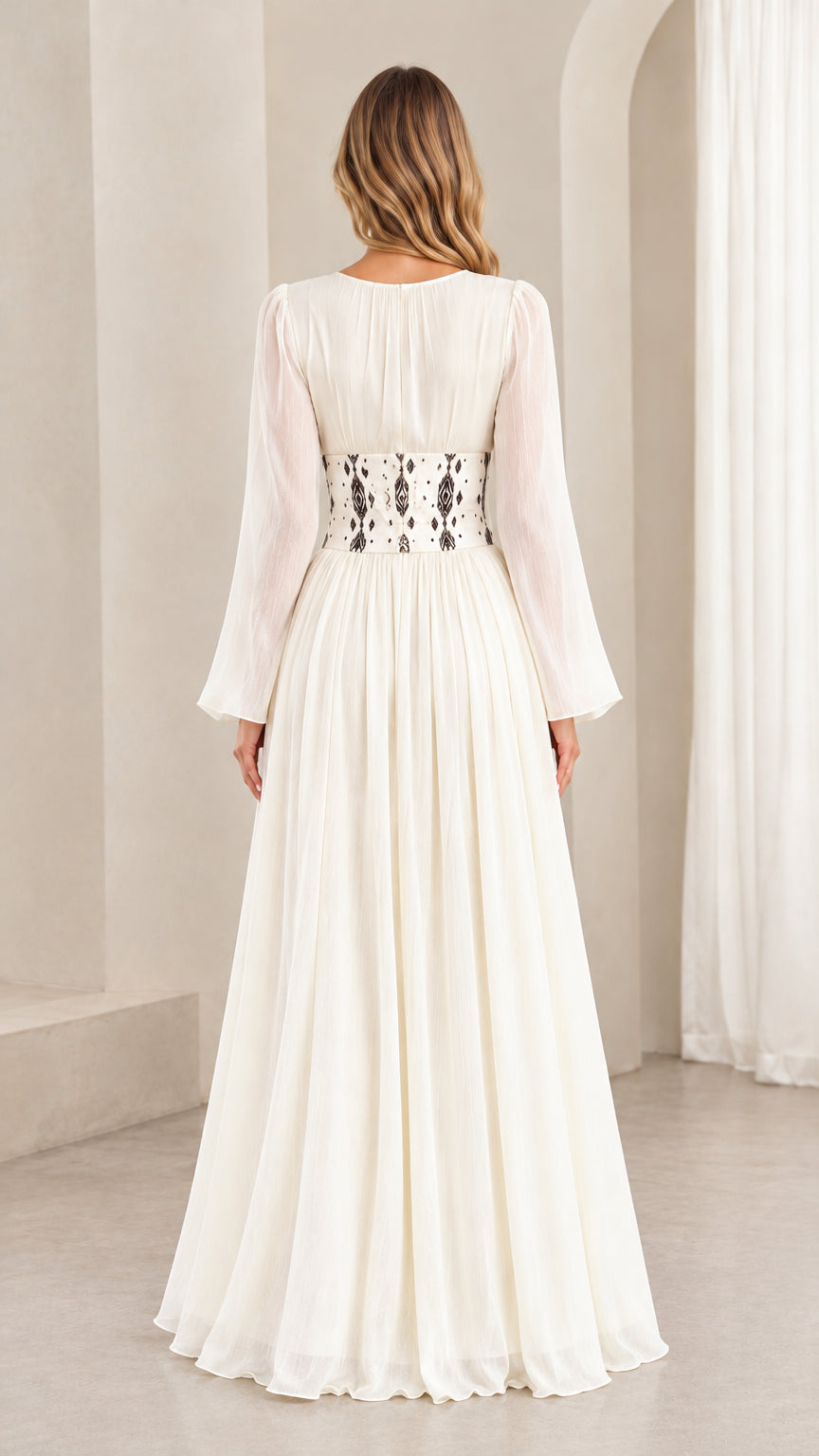 Back view of ivory long sleeve maxi dress highlighting fitted corset waistband