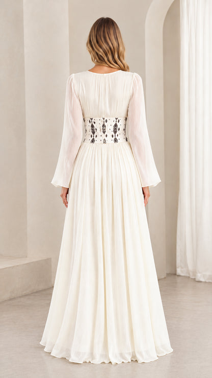 Back view of ivory long sleeve maxi dress highlighting fitted corset waistband
