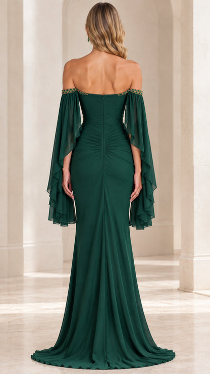Back view of emerald green floor-length evening dress with open back and ruched skirt
