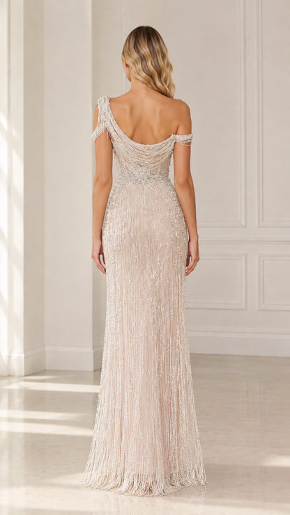 Back view of model showing draped cowl back and beaded details on Champagne maxi gown