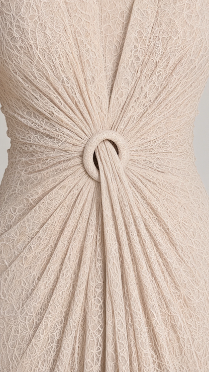 Close-up detail of the gathered lace waist and central ring accent