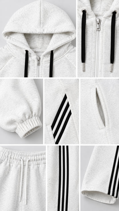 Close-up details of hood drawstring, metal zipper, elastic cuff, side stripes, and pockets