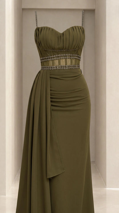 Detailed close-up of olive green pleated bodice and embellished illusion waist
