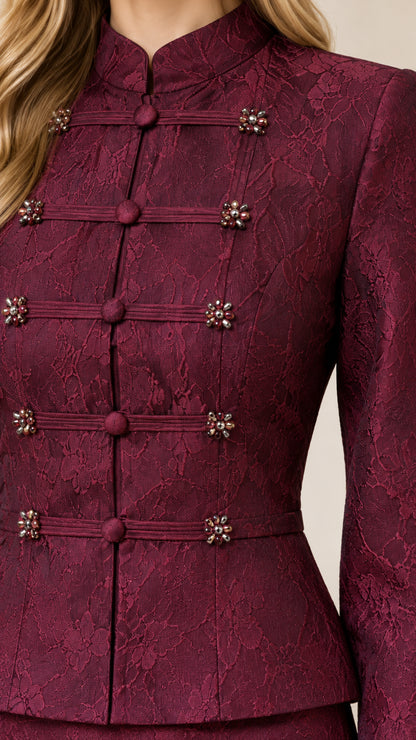 Close-up detail of mandarin collar and embellished frog closures on lace peplum jacket
