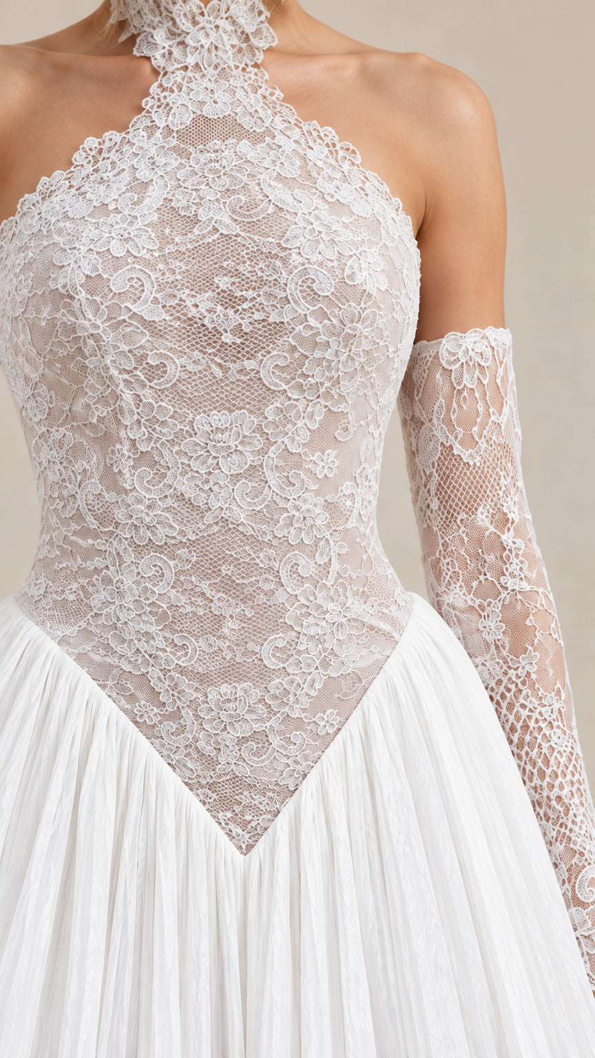 Close-up detail of white floral lace bodice and basque waistline seam