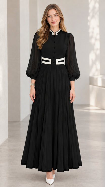 Black pleated maxi dress with white contrast trim and sheer lantern sleeves