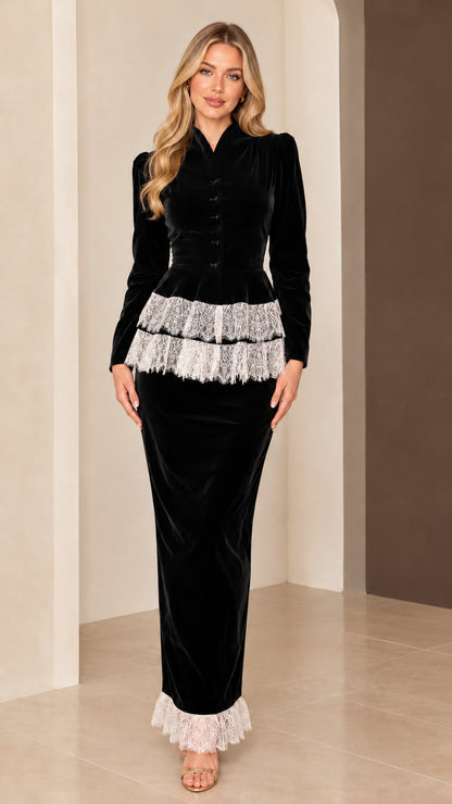 Full-length view of black velvet peplum maxi dress with contrasting white lace accents