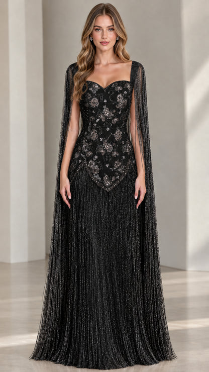 Model wearing black beaded cape sleeve fringe formal gown