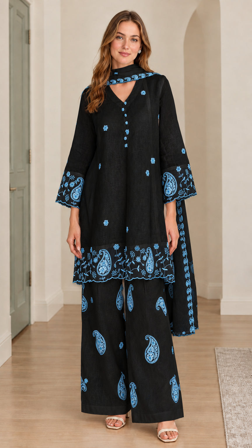 Model wearing black 3-piece embroidered tunic set with blue paisley embroidery