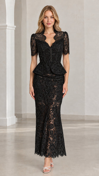 Front view of woman wearing black floral lace peplum maxi two-piece set