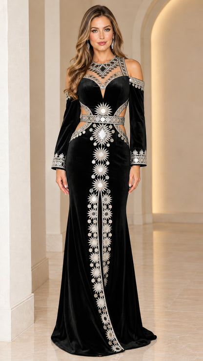 Model wearing Black embellished velvet cold-shoulder evening gown with waist cutouts