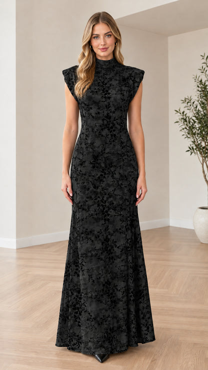 Front view of woman wearing black floral mock neck maxi dress