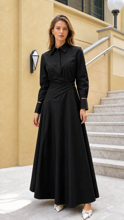 Full view of woman wearing black long-sleeve wrap maxi dress