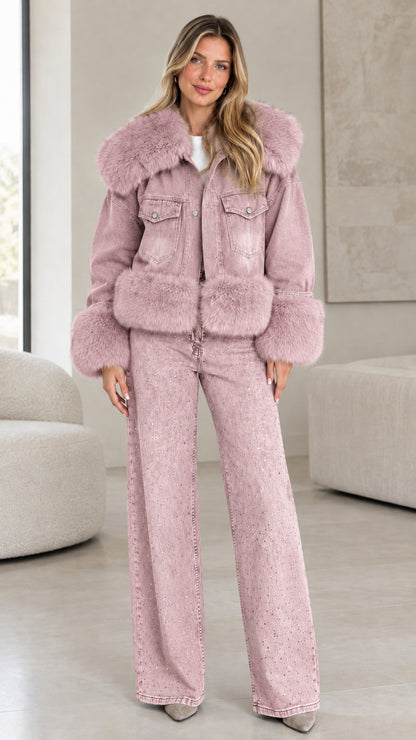 Model wearing dusty pink washed denim jacket with matching pink faux fur trim and wide-leg jeans