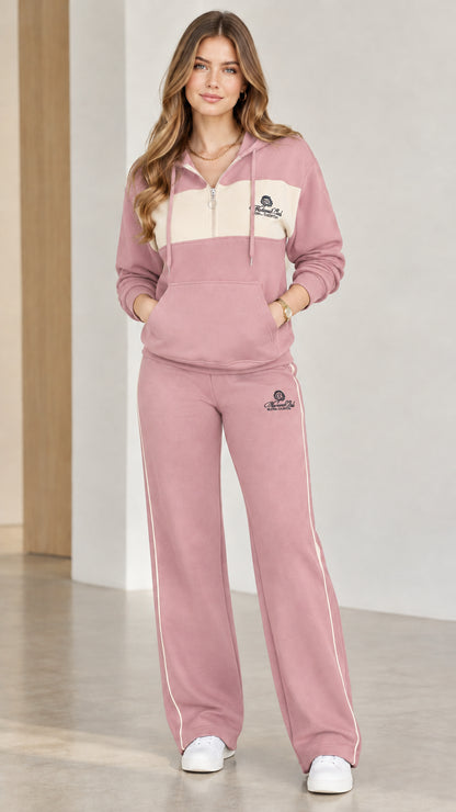 Model wearing dusty pink colorblock half-zip hoodie and wide-leg sweatpants set