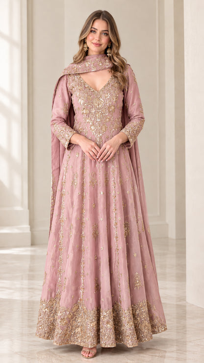 Front view of woman wearing dusty pink embroidered Anarkali gown with dupatta