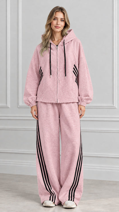 Front view of woman wearing Dusty Pink zip-up hoodie and wide-leg striped sweatpants set