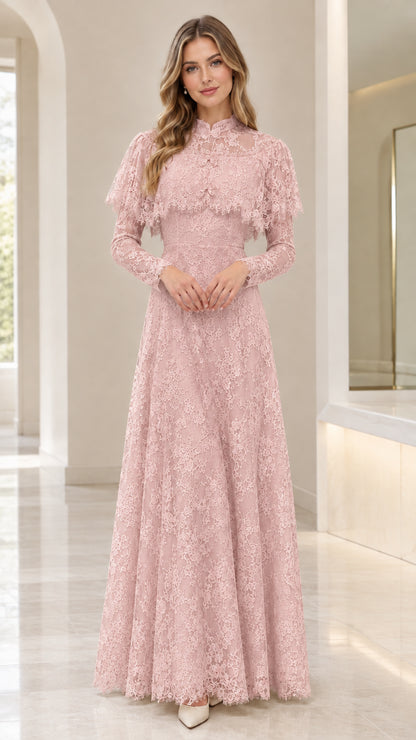 Front view of woman wearing blush pink lace capelet formal dress