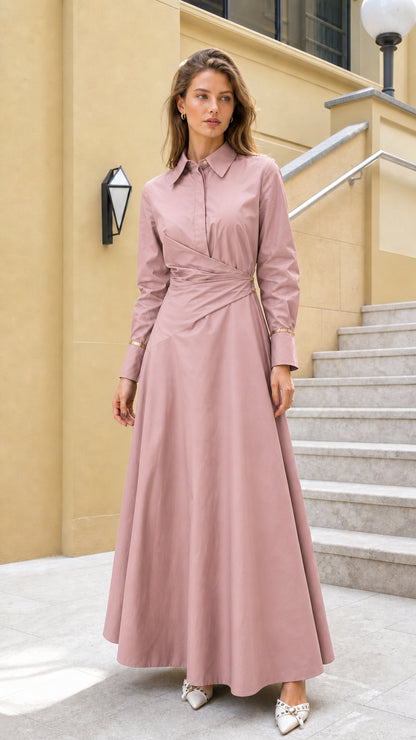 Full view of woman wearing pink long-sleeve wrap maxi dress
