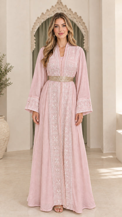 Model wearing dusty pink embroidered floor-length kaftan dress