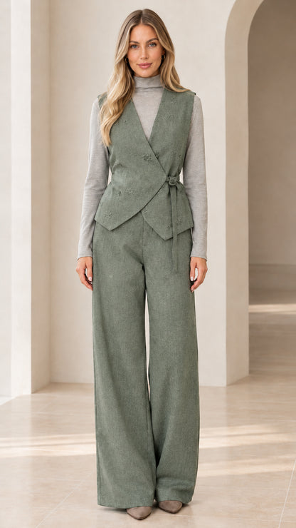 Woman wearing sage green wrap tie vest and matching wide-leg trousers