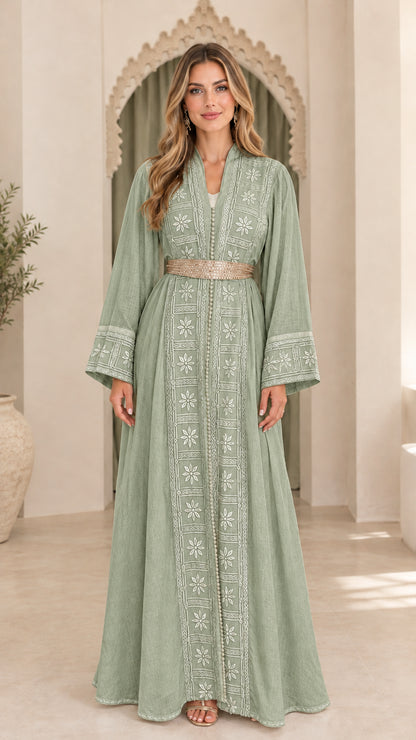 Model wearing sage green embroidered long sleeve maxi abaya dress