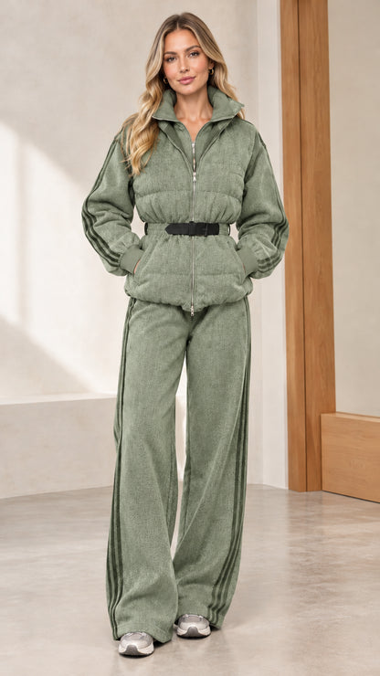 Front full view of woman wearing sage green quilted puffer jacket and wide-leg pants set