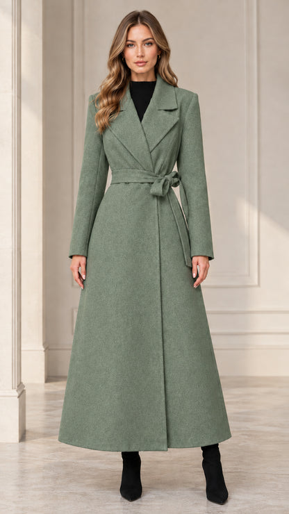 Front view of woman wearing the sage green belted maxi wrap coat