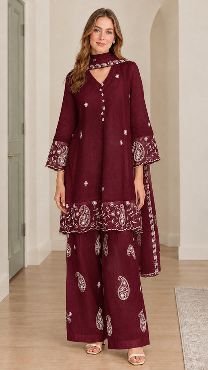 Model wearing burgundy 3-piece embroidered tunic set with white floral embroidery