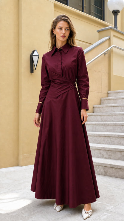 Full view of woman wearing burgundy long-sleeve wrap maxi dress